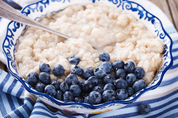 Oatmeal with blueberries and honey. Healthy Breakfast.selective focus