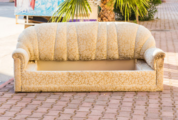 Old abandoned couch dumped on the street
