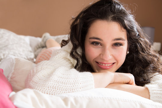 Happy Woman Lazing In Bed