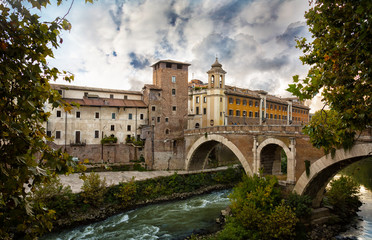 Fototapeta na wymiar Ponte Sant Angelo (St. Angelo Bridge ) and the Trastevere district in Rome with River Tiber, Italy