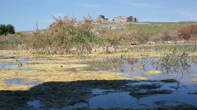 Swamp lake with ruins and mountain with ruins of ancient Miletus