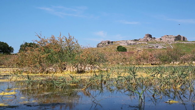 Swamp lake with ruins and mountain with ruins of ancient Miletus