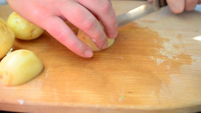 The cook cuts potato