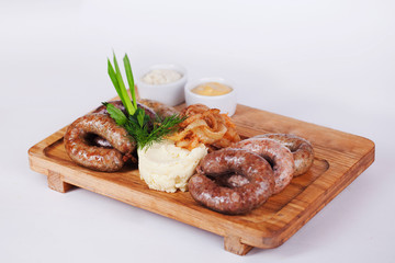 sausages with mashed potatoes, wooden board, isolated, white