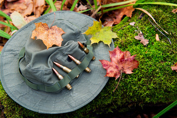 several bullets and military hat