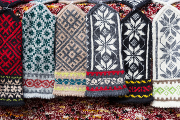 Colorful knitted woolen mittens on sale