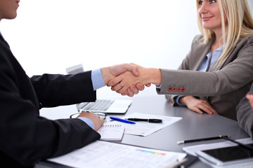 Business people shaking hands, finishing up a meeting, copy spase area