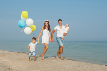 Family having fun on the beach