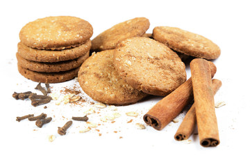 Cookies honey with nuts, cereals, cinnamon and cloves on a white background