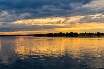 Fototapeta na wymiar Sunset with dramatic sky over Nove Mlyny lake, Mikulov, Czech Republic