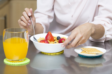 Attractive woman having breakfast