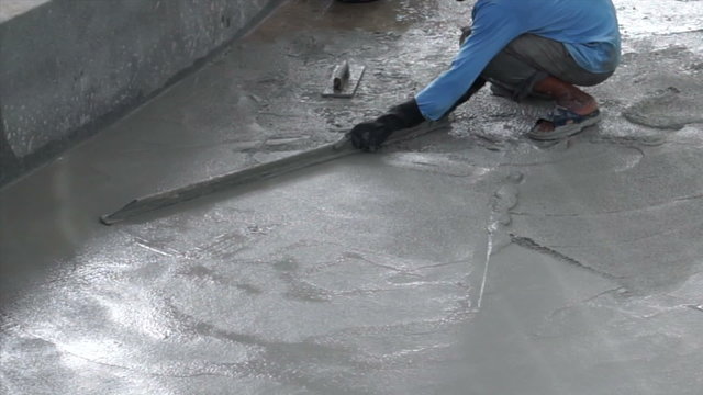 Video of Special plastering equipment for troweling cement floor surface smoothening adjustment. Construction technique and skill