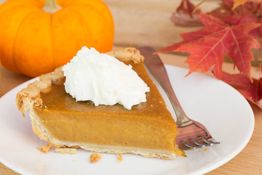 Pumpkin Pie Slice With Autumn Decorations