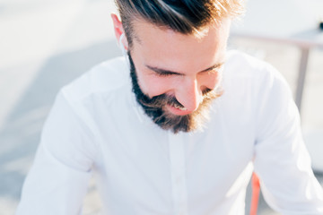 Young modern businessman posing