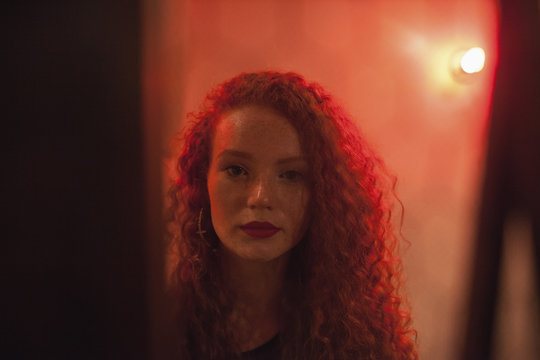 Portrait of a young woman at a nightclub