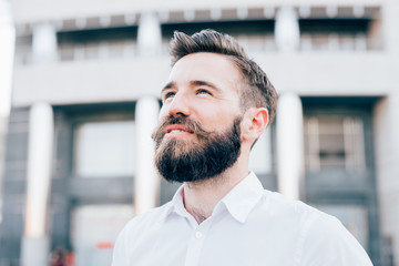 Young modern businessman posing