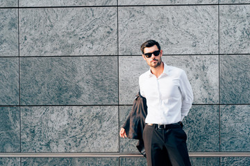 Young modern businessman posing