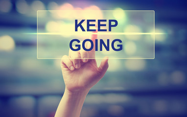 Hand pressing Keep Going