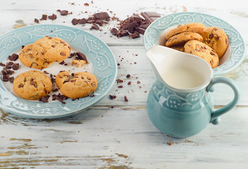 Chocolate chip cookies with milk  on wooden table.