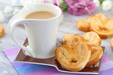 Cup of coffee and heart cookies