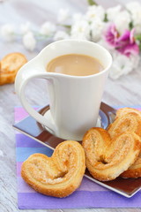 Cup of coffee and heart cookies