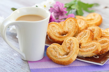 Cup of coffee and heart cookies