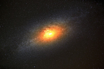Brightest galaxy in the background of dark sky with stars