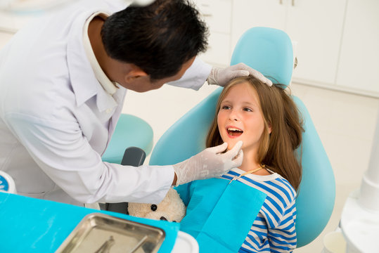 Examining teeth and gums