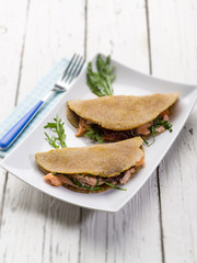 sandwich with arugula and smoked salmon, selective focus