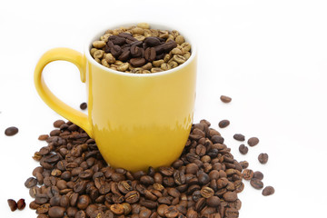 selective focus of coffee bean in yellow cup on white background