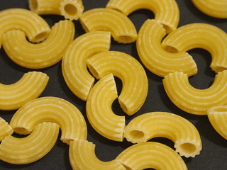 Macaroni on black background