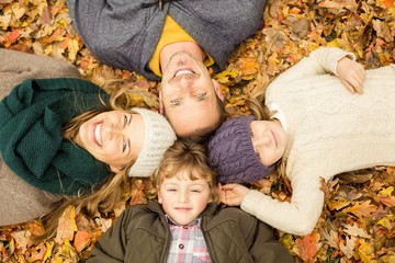 Smiling young family doing a head circles