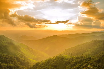 Obraz na płótnie Canvas Sunrise Over Mountain with Rain Forest