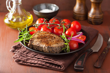beef steak with spices and rosemary in plate