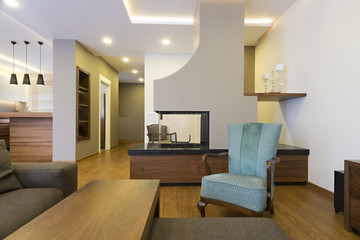Fototapeta na wymiar Modern apartment interior with fireplace