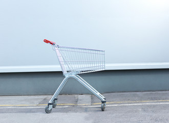 Shopping cart isolated on metal background