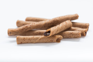 Chocolate wafer sticks isolated on white background.