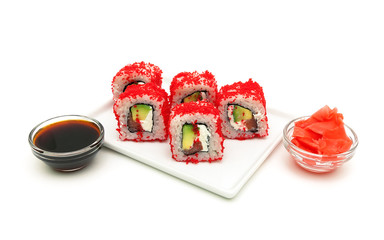 Japanese rolls with avocado and caviar close-up on a white backg