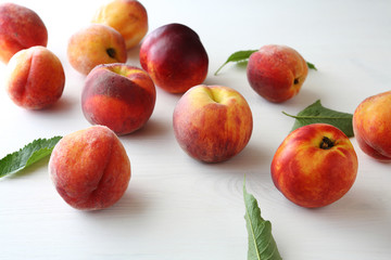 fresh ripe peaches and leaves