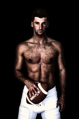 Fototapeta premium Composite image of portrait of a shirtless man holding ball