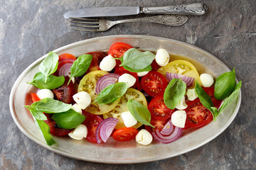 caprese salad with basil leaves