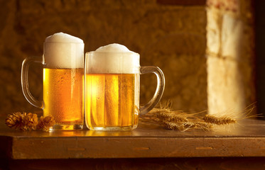 beer still life on the table with grain and hops