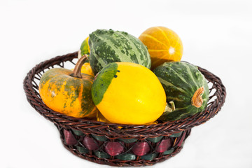 Basket full of colorful pumpkins/squashes