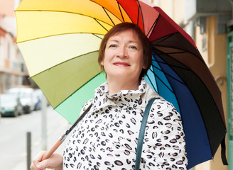 mature woman with umbrella