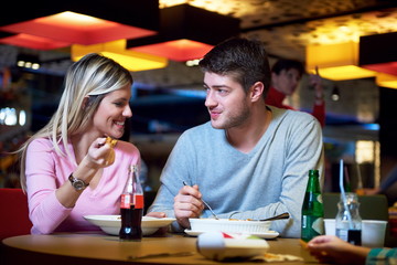 couple having lunch break in shopping mall