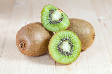 Fresh kiwi fruits on wooden