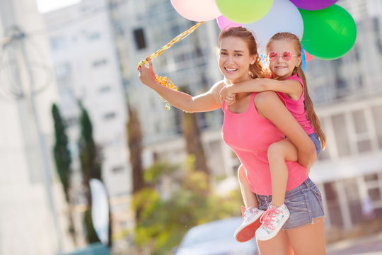 Mother and child with colorful balloons