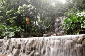 beautiful man-made waterfall in the park