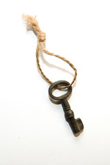 Vintage key on a rope on over white