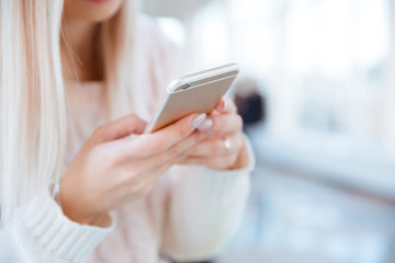Female hands using smartphone